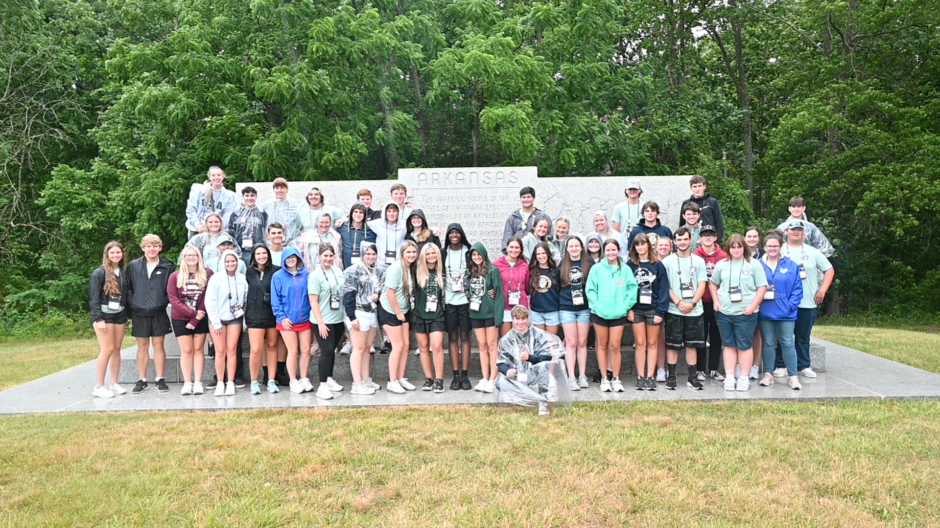 Youth Tour participants standing in front of an Arkansas monument in Washington DC
